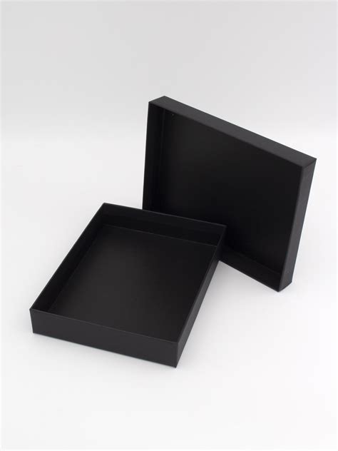 small black boxes with lids